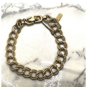 Monet gold tone vintage link bracelet with safety chain